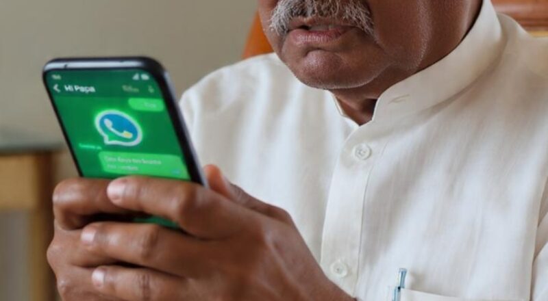 elderly senior worried looking at WhatsApp fraud message on smartphone 2026